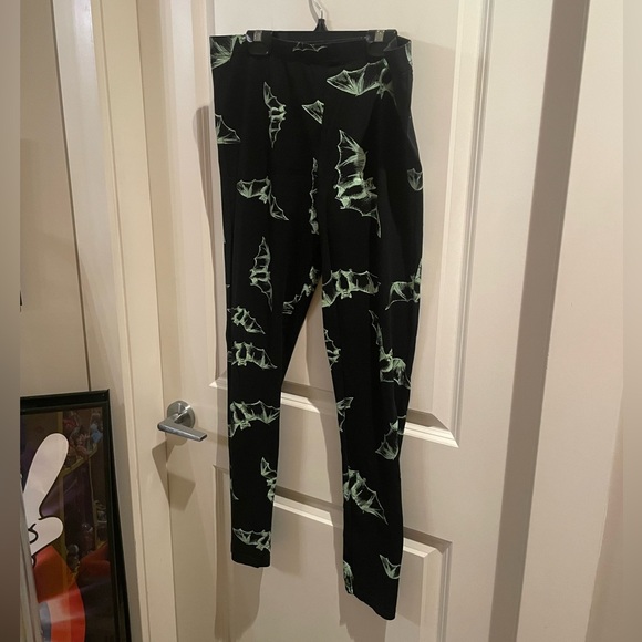 Dolls Kill Pants - Dolls Kill Black Leggings with Green Bat Design